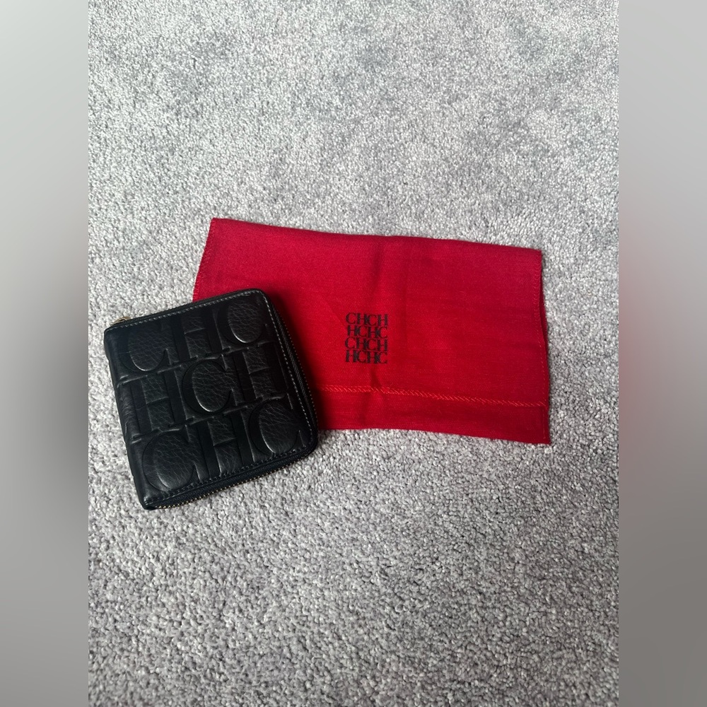 New with tags real black leather CH Carolina Herrera zip-around leather wallet.